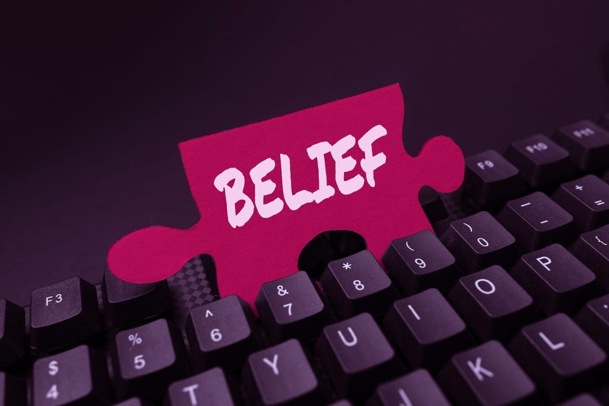 A puzzle piece witht he word Belief on it.